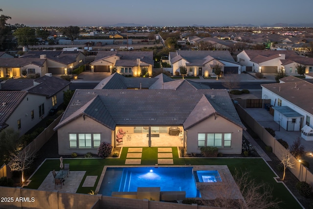 view of pool at dusk