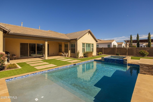 view of pool with a patio area and an in ground hot tub