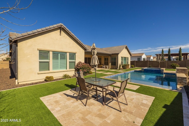 view of pool with a yard and a patio area