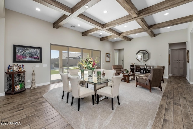 dining area with coffered ceiling, beam ceiling, and hardwood / wood-style flooring