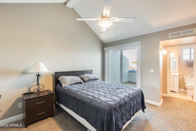 bedroom featuring light carpet, lofted ceiling with beams, ensuite bathroom, and ceiling fan