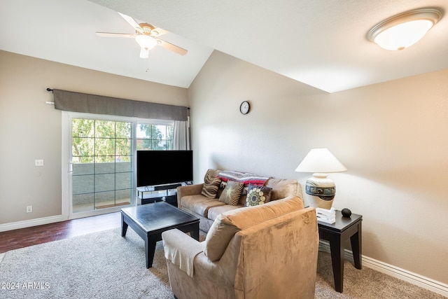 living room with ceiling fan, wood-type flooring, and vaulted ceiling