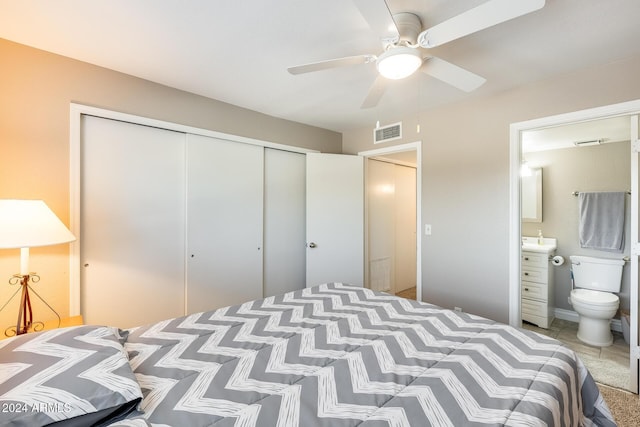 bedroom with ensuite bathroom, a closet, and ceiling fan