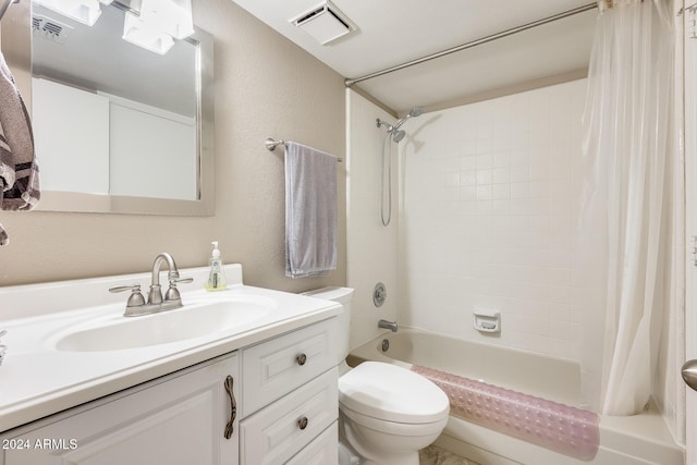 full bathroom with vanity, toilet, and shower / tub combo with curtain