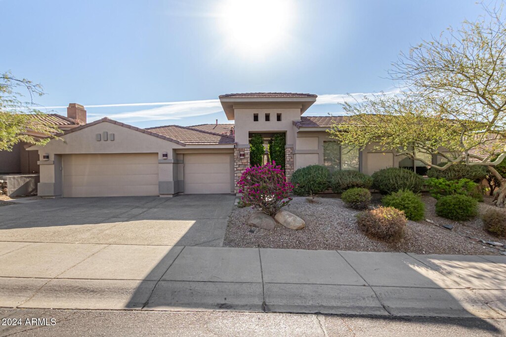 10975 E Greenway Rd, Scottsdale, AZ 85255 - mediterranean / spanish home featuring a garage
