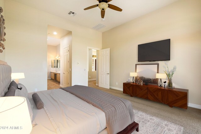 unfurnished living room featuring ceiling fan, light colored carpet, and a premium fireplace