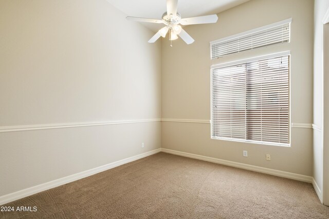 unfurnished living room featuring light carpet, ceiling fan, a premium fireplace, and sink