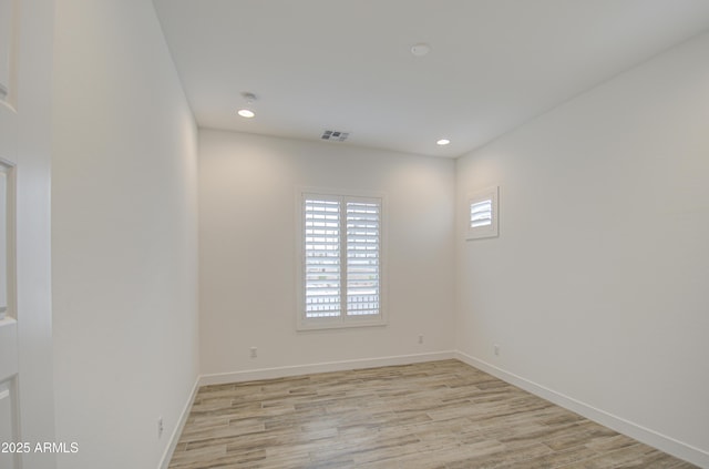 spare room with recessed lighting, baseboards, visible vents, and light wood finished floors