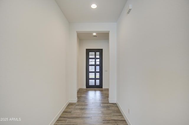 doorway to outside featuring recessed lighting, french doors, baseboards, and wood finished floors