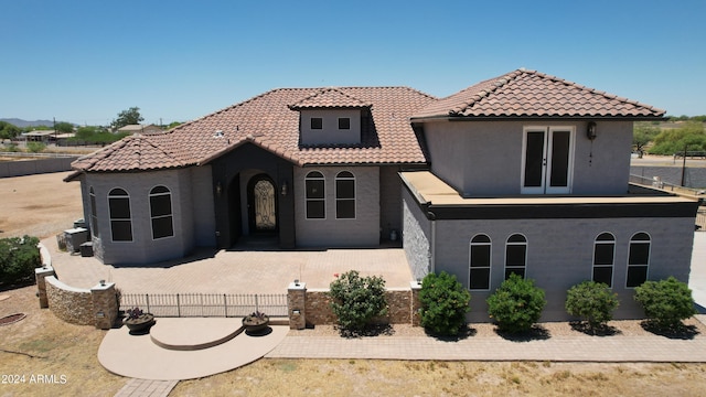 7171 W Quarter Horse Run, Coolidge, AZ 85128 - mediterranean / spanish-style house featuring a balcony, a tile roof, stucco siding, and french doors