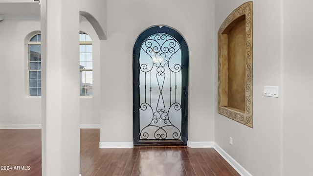 7171 W Quarter Horse Run, Coolidge, AZ 85128 - entrance foyer featuring dark wood-style floors, arched walkways, and baseboards