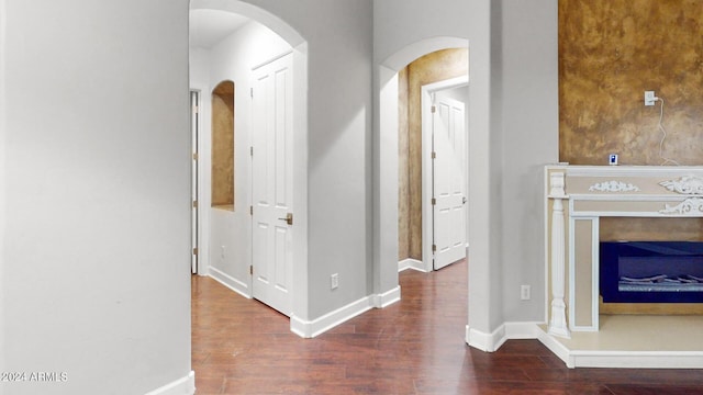 7171 W Quarter Horse Run, Coolidge, AZ 85128 - corridor with arched walkways, baseboards, and wood finished floors