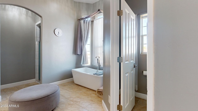 7171 W Quarter Horse Run, Coolidge, AZ 85128 - full bathroom with a soaking tub, a stall shower, and baseboards