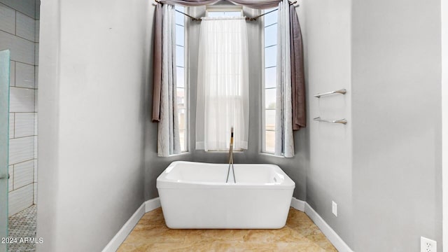 7171 W Quarter Horse Run, Coolidge, AZ 85128 - full bathroom featuring baseboards and a freestanding tub