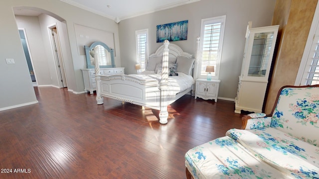 7171 W Quarter Horse Run, Coolidge, AZ 85128 - bedroom with dark wood-style floors, crown molding, arched walkways, and baseboards