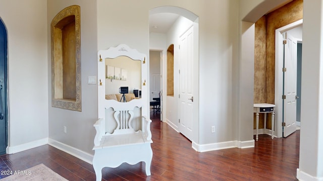 7171 W Quarter Horse Run, Coolidge, AZ 85128 - corridor featuring baseboards, arched walkways, and wood finished floors