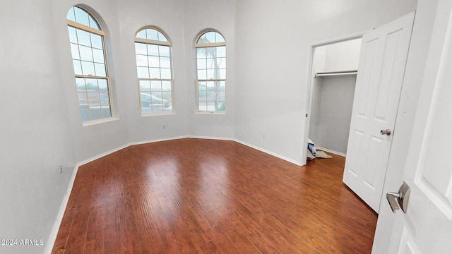 7171 W Quarter Horse Run, Coolidge, AZ 85128 - unfurnished bedroom featuring baseboards and dark wood-style flooring