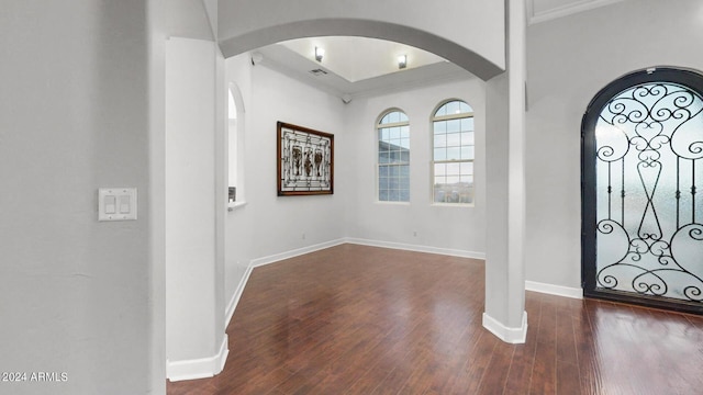 7171 W Quarter Horse Run, Coolidge, AZ 85128 - entryway with baseboards, arched walkways, wood finished floors, and ornamental molding