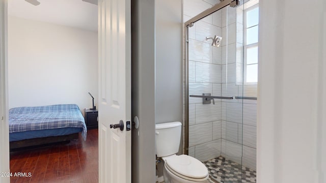 7171 W Quarter Horse Run, Coolidge, AZ 85128 - ensuite bathroom featuring a stall shower, wood finished floors, toilet, and ensuite bathroom