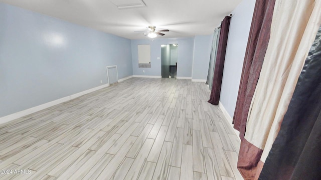 7171 W Quarter Horse Run, Coolidge, AZ 85128 - interior space featuring attic access, baseboards, light wood-style flooring, and ceiling fan