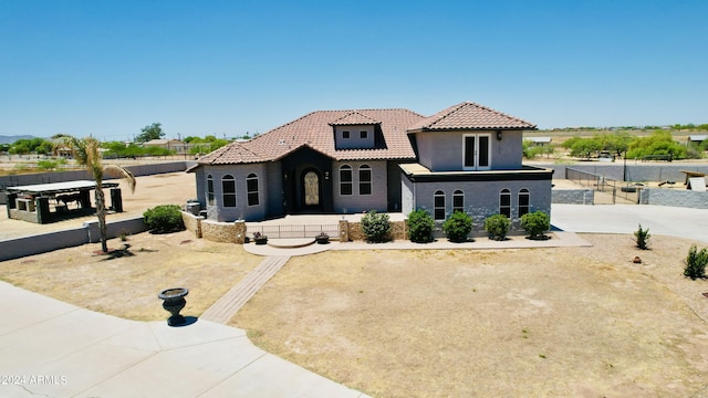 7171 W Quarter Horse Run, Coolidge, AZ 85128 - mediterranean / spanish-style house featuring a tile roof, stucco siding, and fence