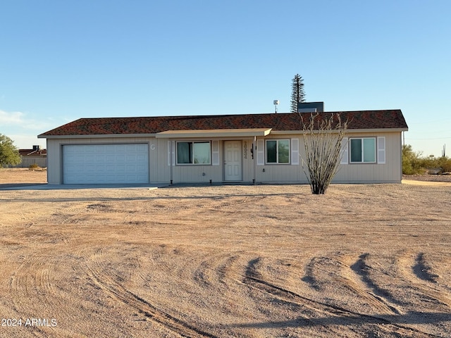 single story home with a garage