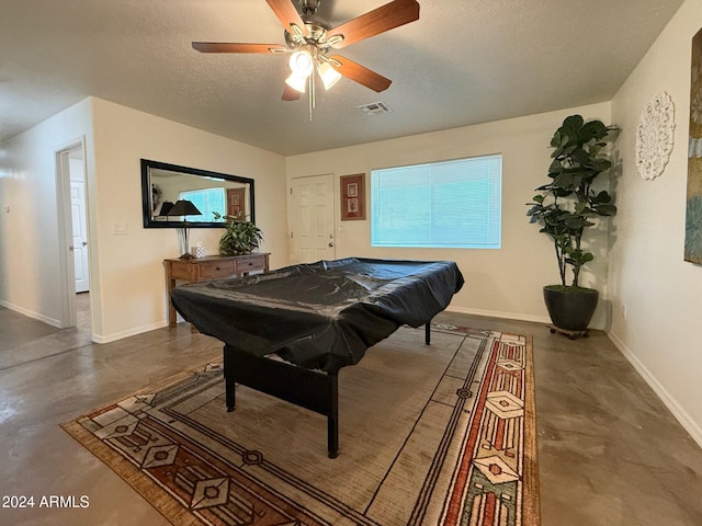 game room featuring ceiling fan, a textured ceiling, and pool table