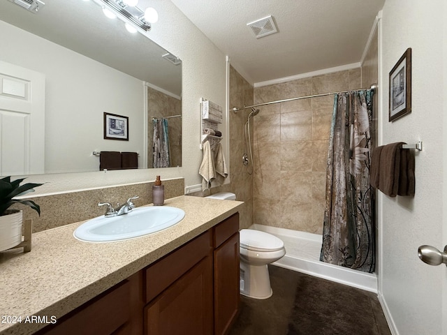 bathroom featuring vanity, a shower with shower curtain, a textured ceiling, and toilet