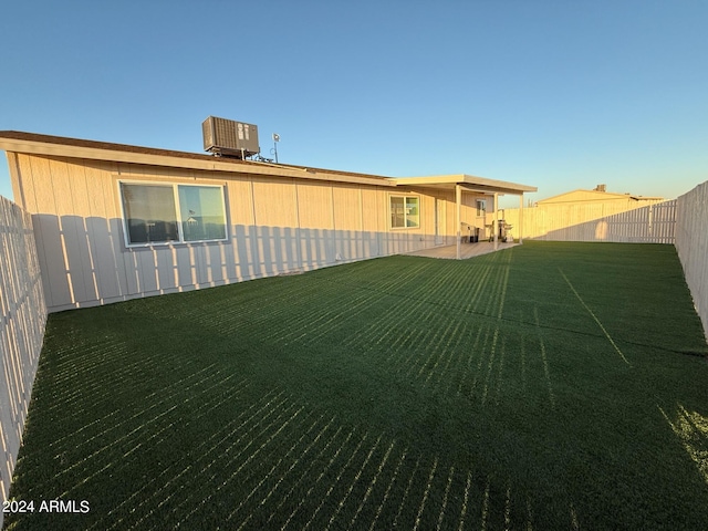 view of yard featuring a patio area and central AC unit