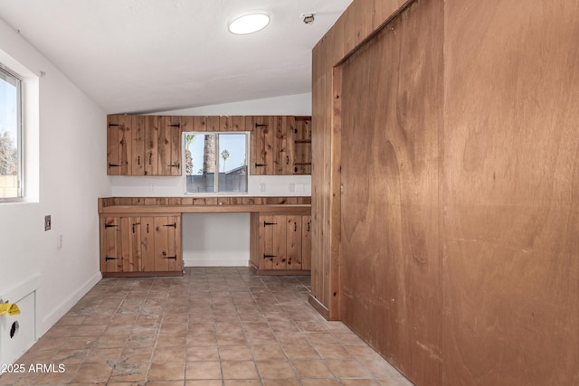 kitchen with lofted ceiling