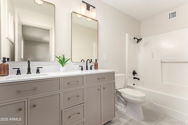 full bathroom featuring toilet, vanity, and shower / bathtub combination