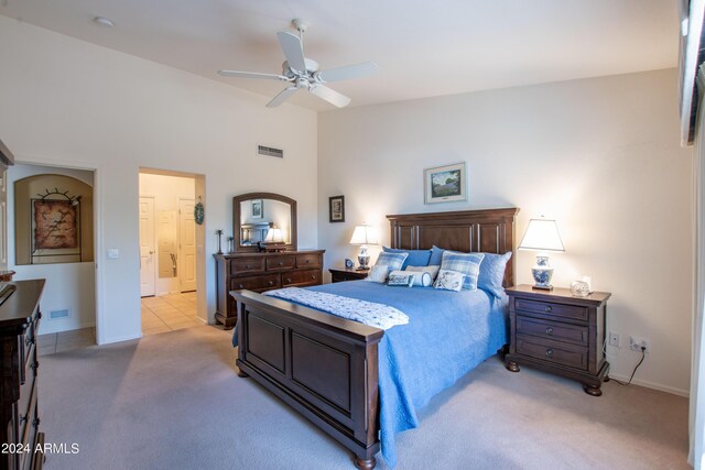 living room featuring lofted ceiling, ceiling fan, light tile patterned floors, and a healthy amount of sunlight