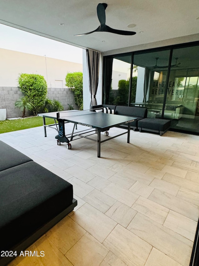 view of patio / terrace featuring ceiling fan