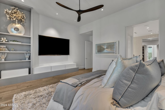 bedroom with hardwood / wood-style floors and ceiling fan