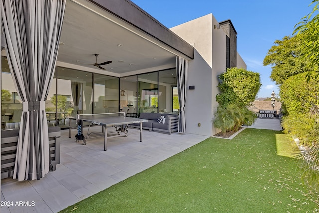 view of patio / terrace featuring outdoor lounge area and ceiling fan