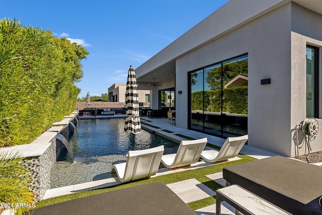 view of pool featuring a patio area and pool water feature