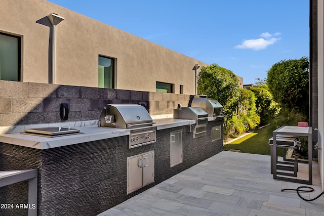 view of patio featuring exterior kitchen and area for grilling