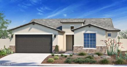 view of front facade featuring a garage, brick siding, driveway, and stucco siding