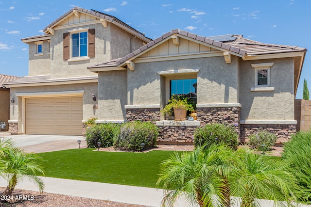 view of front of home featuring solar panels, a garage, and a front lawn