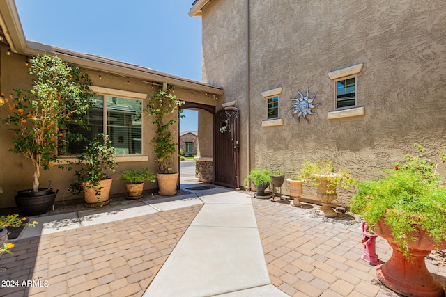 doorway to property with a patio area