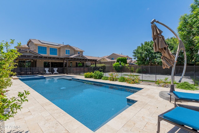 view of swimming pool with a patio area