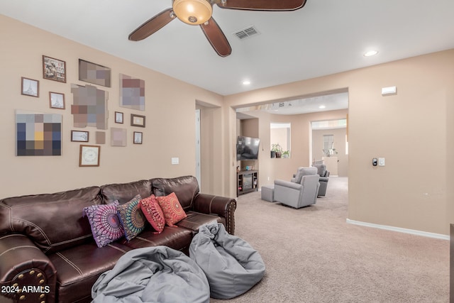 living room with ceiling fan and carpet floors