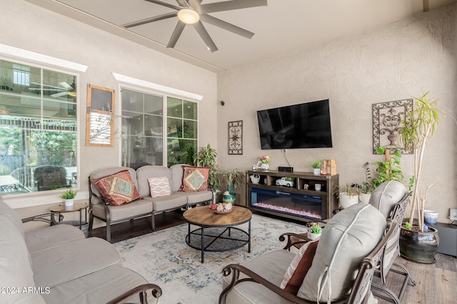 living room featuring ceiling fan and wood-type flooring