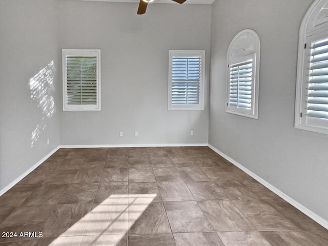 spare room with ceiling fan