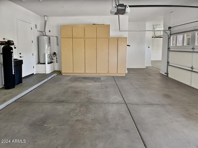 garage with a garage door opener and water heater