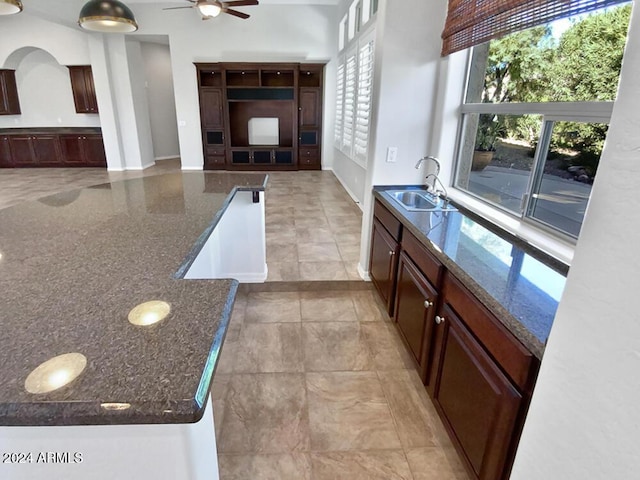 12446 W Bajada Rd, Peoria, AZ 85383 - bathroom with a sink, a ceiling fan, and baseboards