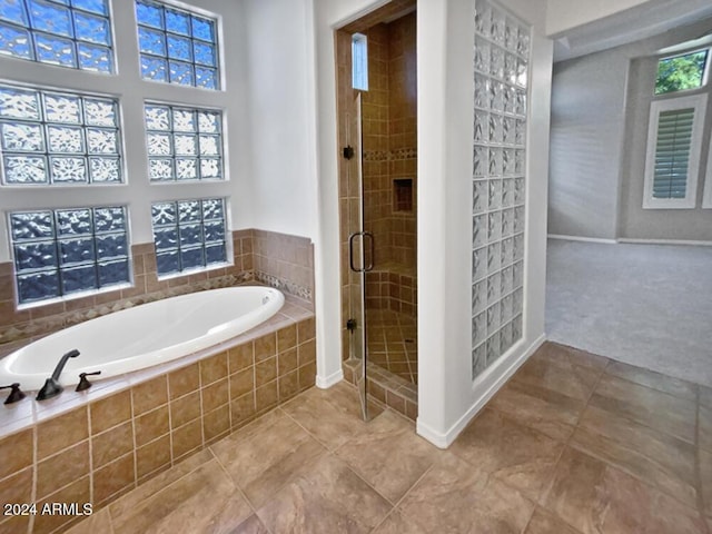 12446 W Bajada Rd, Peoria, AZ 85383 - bathroom featuring a bath, tile patterned flooring, a stall shower, and baseboards