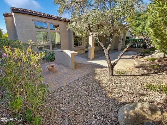 12446 W Bajada Rd, Peoria, AZ 85383 - rear view of house featuring stucco siding, a patio, and a tile roof