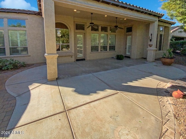 rear view of house with a patio area and ceiling fan