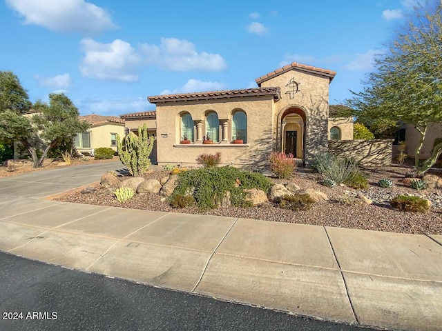 12446 W Bajada Rd, Peoria, AZ 85383 - mediterranean / spanish-style home featuring a tile roof, stucco siding, concrete driveway, and a garage